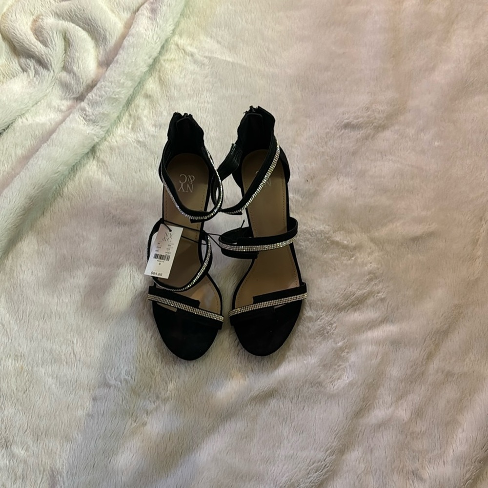 Black with silver trimming. Tags still on.